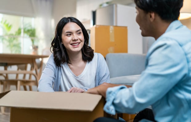 Two individuals unpacking.